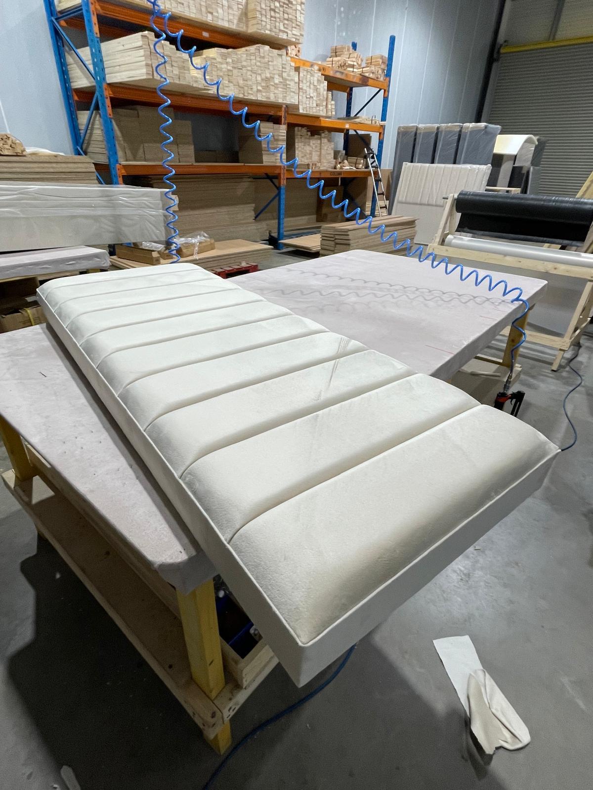 Quality isn't accidental—it's engineered. Here’s a sneak peek at a custom upholstered panel fresh off the workbench. Our team takes pride in the details, ensuring every line is perfectly straight and every cushion offers the premium support our clients expect. Stay tuned to see the finished look!