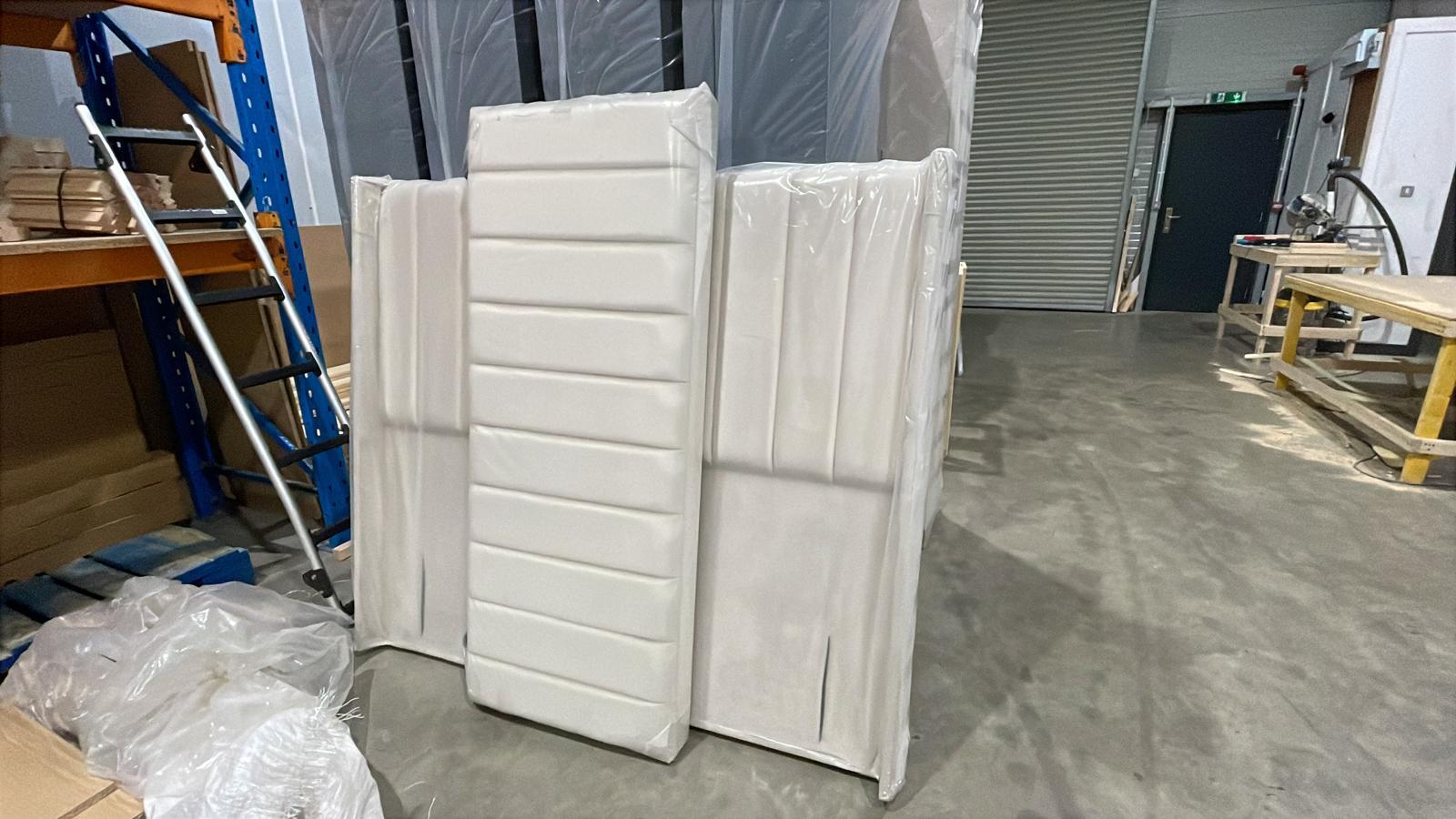 Every luxury bed frame we build is a combination of robust structural design and high-end upholstery. Here is a look at a custom modern bed assembly right off the production line.