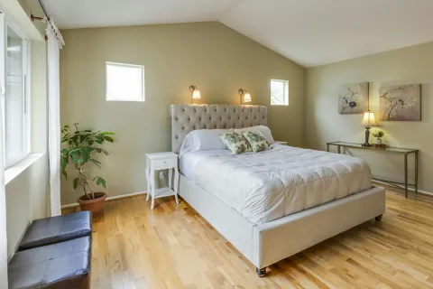 Upholstered bed frame with a slatted base in a bright bedroom